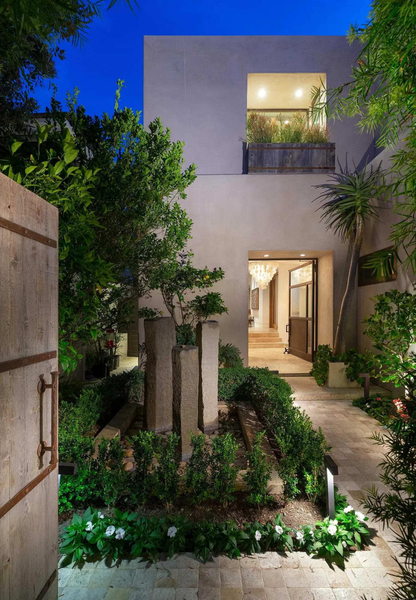 Modern courtyard estate at blue hour